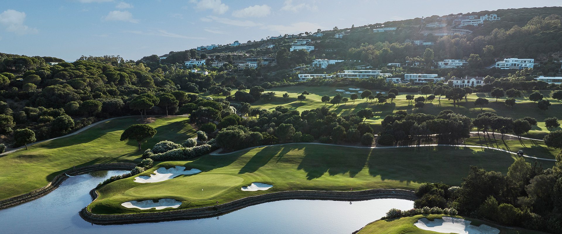 A green surrounded by water at La Reserva Club, Sotogrande